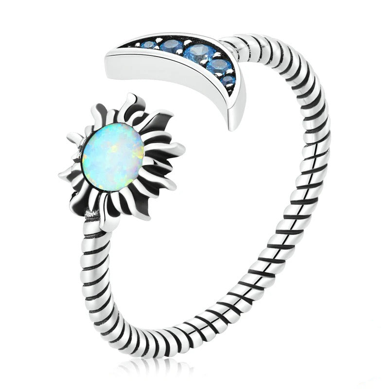 Sun & moon open ring

❤ The twisted oxidized silver open ring with a moon inlaid with blue zircon and a sun inlaid with beautiful opal is exquisitely shining and full of romantic charm.